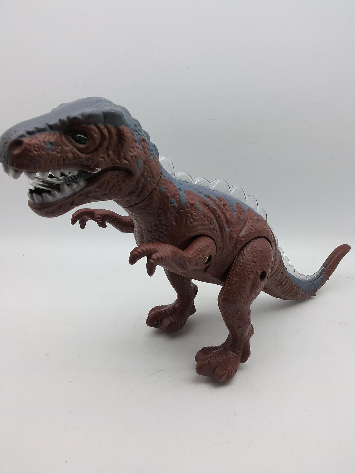 Igračka dinosaurus koji se kreće, svetli i oglašava